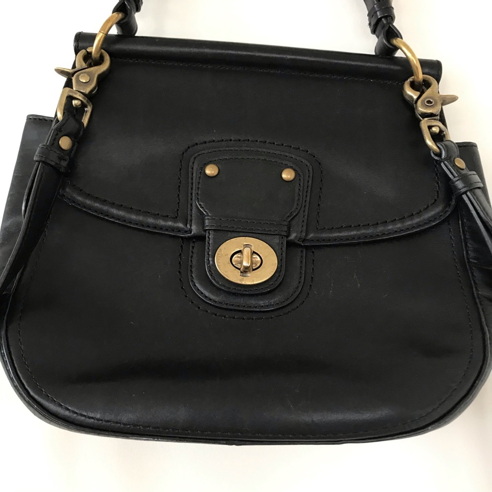Coach cross body bag with turn lock